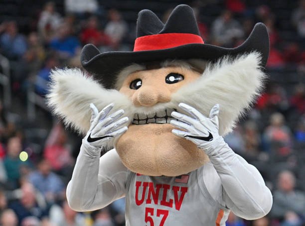 Hey Reb! framing his mustache with both hands
