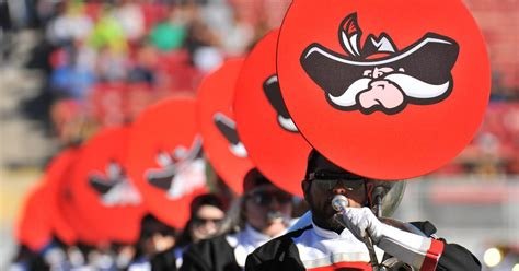 The UNLV band in Hey Reb! hats on the sideline