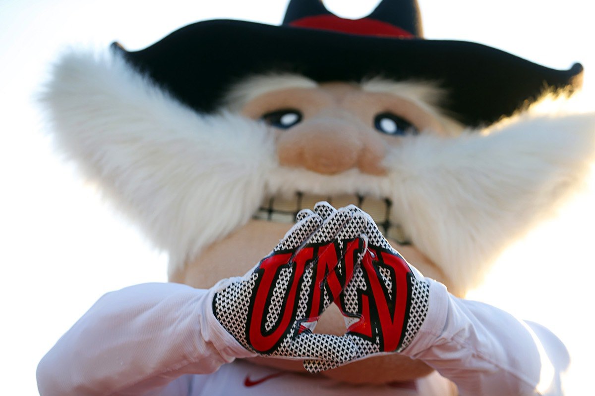 Hey Reb! holding a UNLV sign