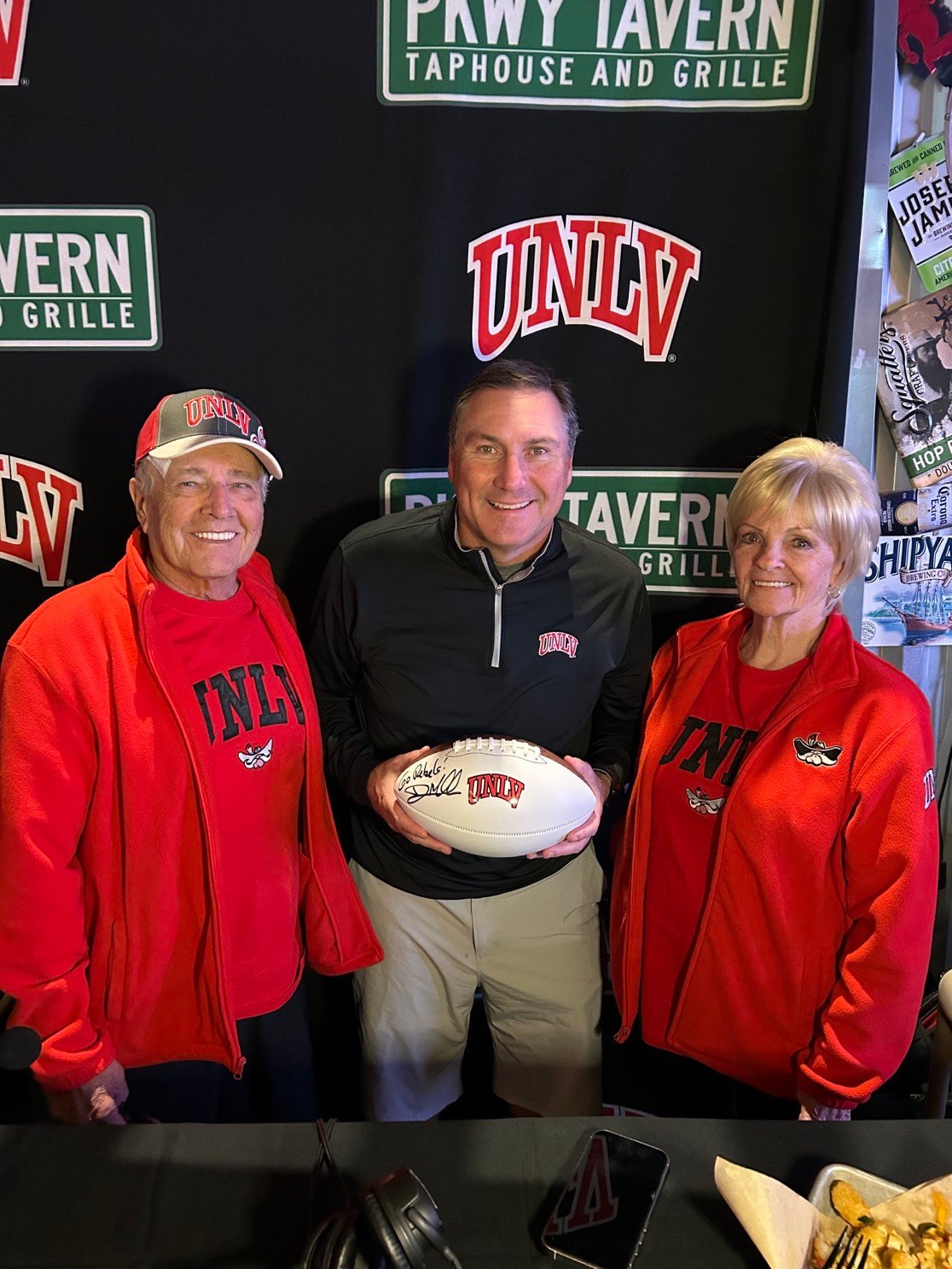 Rebels fans with a signed UNLV football